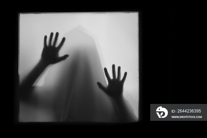 Shadowy figure, ghost behind glass - horror background