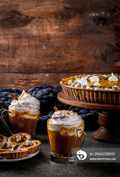 Traditional autumn dishes. Halloween, Thanksgiving. Spicy pumpkin pie, pumpkin tartlets with whipped