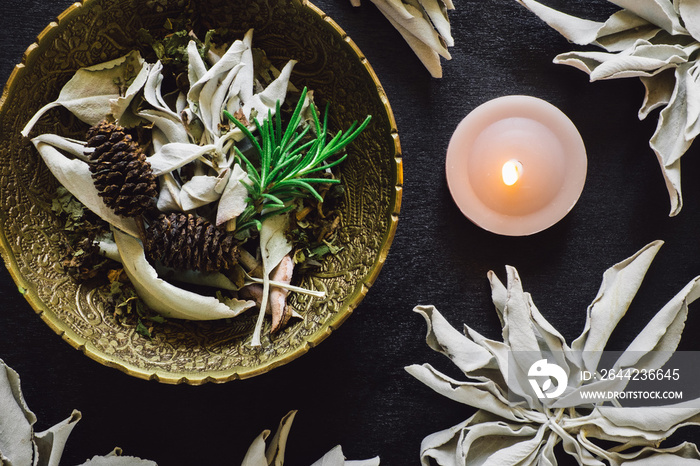Bowl of Mixed Herbs and White Sage with Candle
