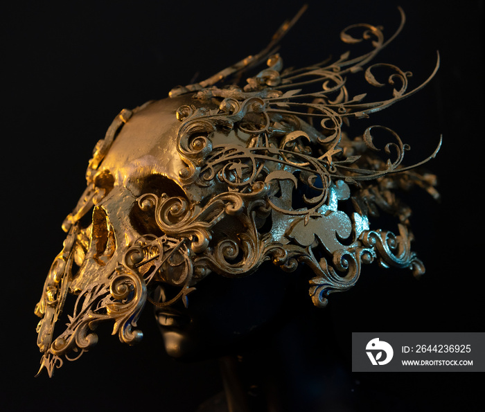 golden skull made with 3d printer and pieces by hand. Gothic piece of decoration for halloween or ho