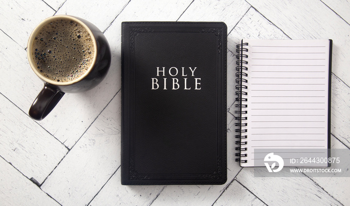 A Black Bible on a White Wooden Table for a Bible Study