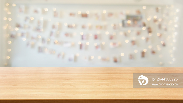 Wood table in blurry background of modern restaurant room or coffee shop with empty copy space on the table for product display mockup. Interior restaurant counter design concept.