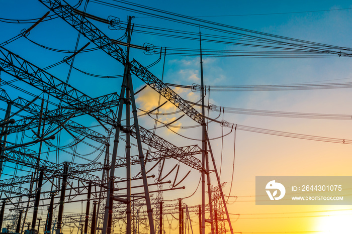 High voltage electricity tower at sunset.substation industrial background.