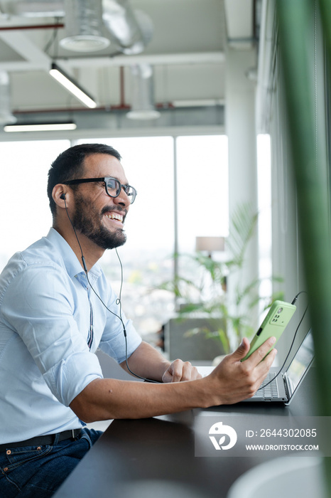 Businessman with laptop working in modern office