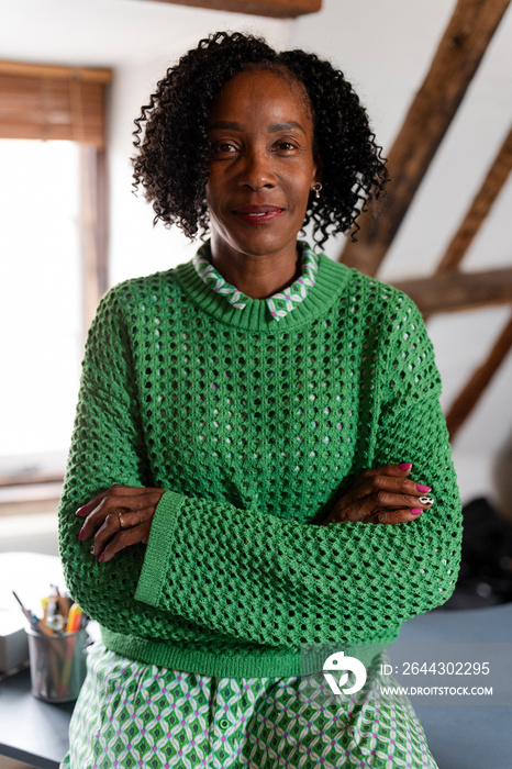 Portrait of confident businesswoman with crossed arms in office