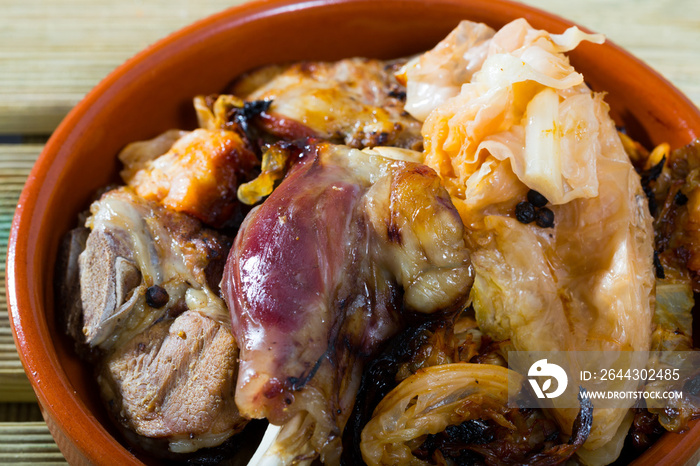 Traditional Norwegian Farikal - stewed mutton meat with cabbage and peppercorns served in clay dishware. High quality photo