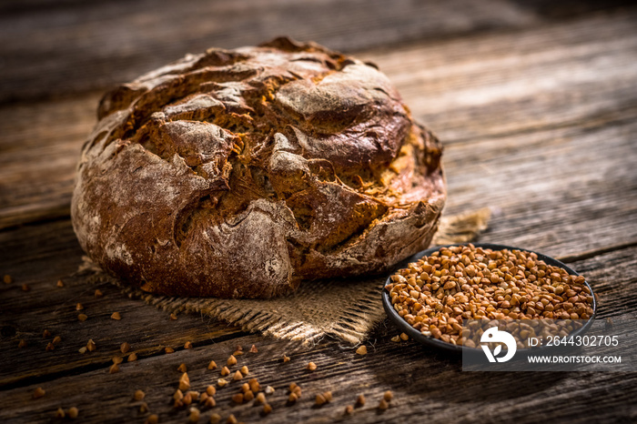 Freshly baked  bread on rustic wooden background