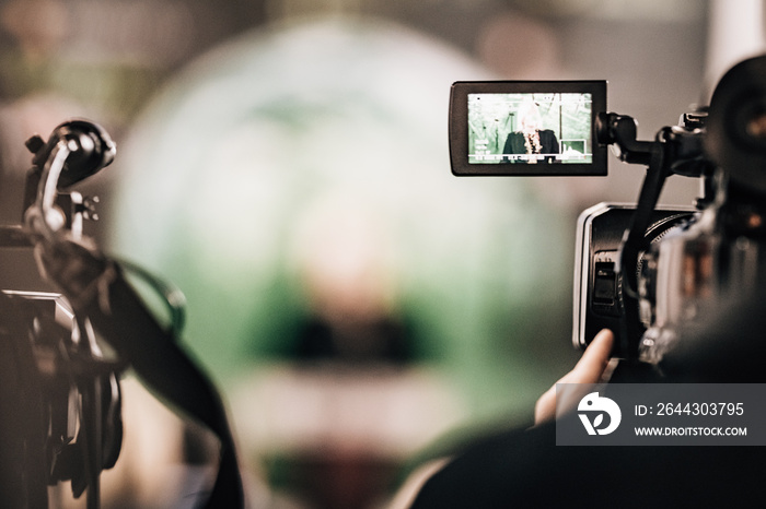 Cameraman Recording a Media Event