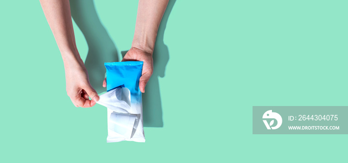 Sanitizer wipe - healthcare and hygiene concept - overhead view