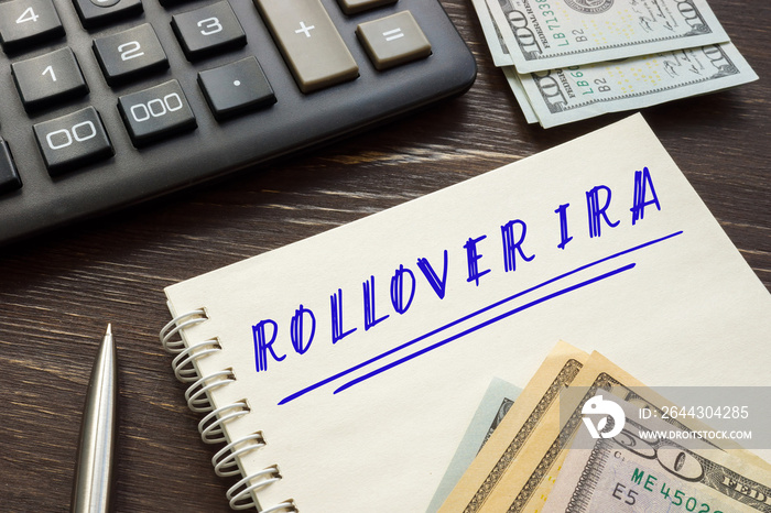 Business concept meaning ROLLOVER IRA with phrase on the piece of paper.