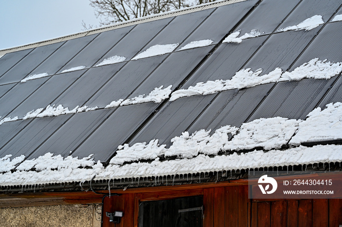 solar panels on barn roof a cold winter day