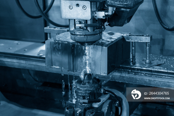 The wire EDM machine cutting the insert mold parts.