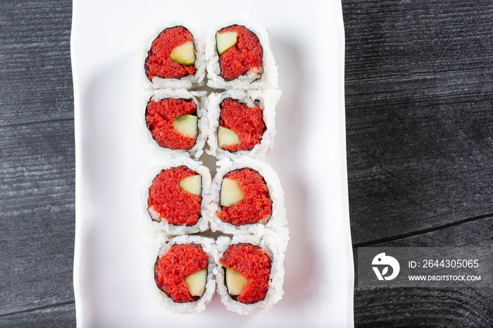 A top down view of a spicy tuna roll.