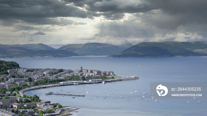 View of Gourock coastal seaside town from Lyle Hill in Greenock during the storm light and dark clouds over mountain  range Scotland UK