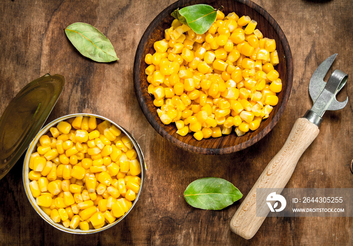 Canned corn in bowl on the board.