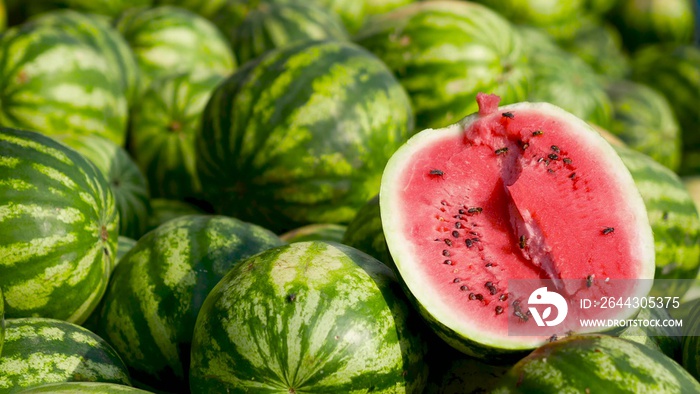 Sale of watermelons. Red and juicy watermelon. Attracts insects with its sweetness.