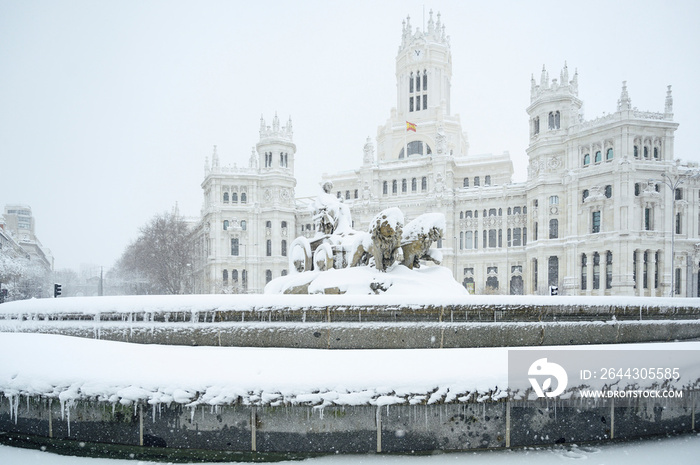 fountain at the Plaza de Cibeles in Madrid covered in snow after the storm Filomena passed through the capital. Nevada in Madrid. Filomena storm, extreme cold in the capital of Spain