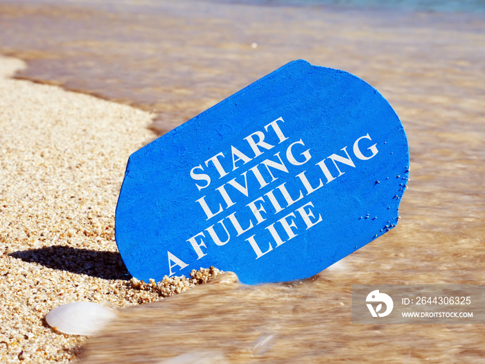 Start living a fulfilling life written on a plank.