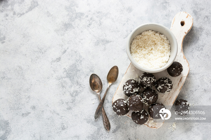 Healthy energy balls with rolled oats, nuts and dried fruits. Vegan bites. Top view, copy space.