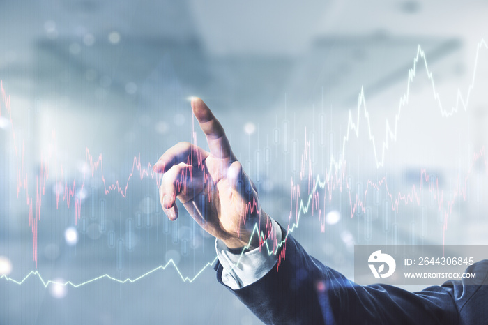 Double exposure of man hand working with virtual creative financial diagram on blurred office background, banking and accounting concept