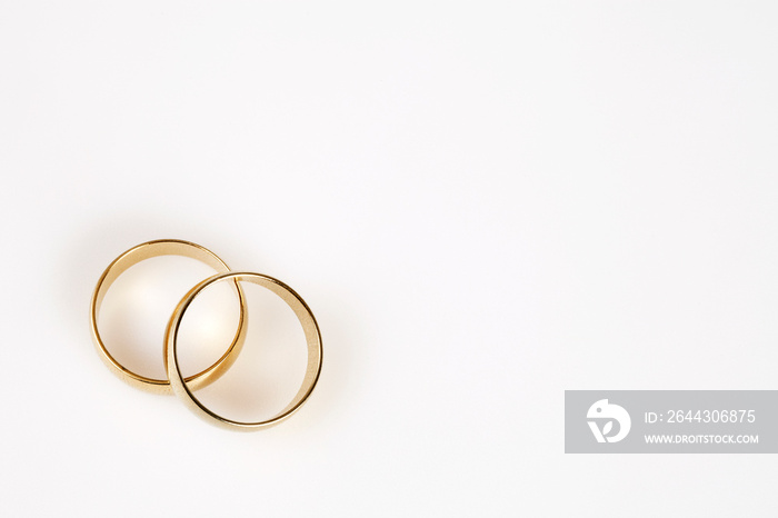 wedding rings over white background