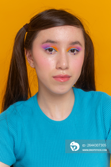 Studio portrait of girl with colorful make-up