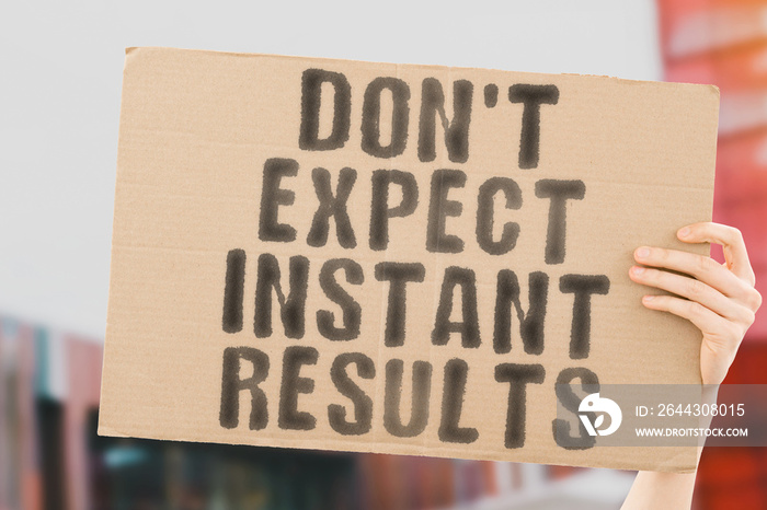 The phrase   Don’t expect instant results   on a banner in men’s hands with blurred background. Productivity. Process. Personal. Plan. Planning. Successful. Strategy. Urgent. Moment. Success. Action