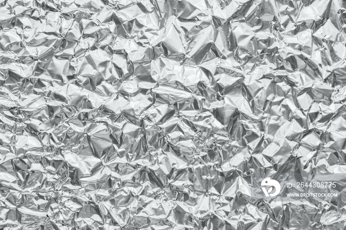 Shiny metal silver gray foil crumpled texture background