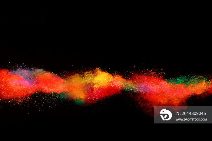 Explosion of colored powder on black background.