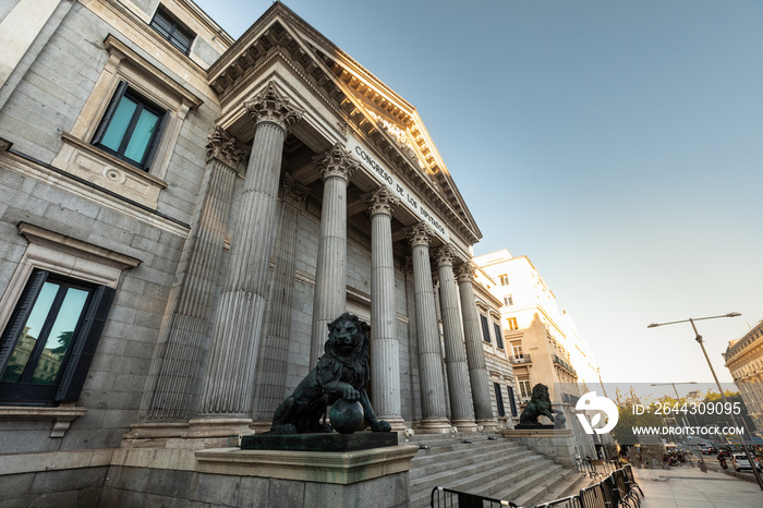 Spanish parliament (Congreso de los diputados) famous facade with two lions sculptures at each side; Madrid, Spain.