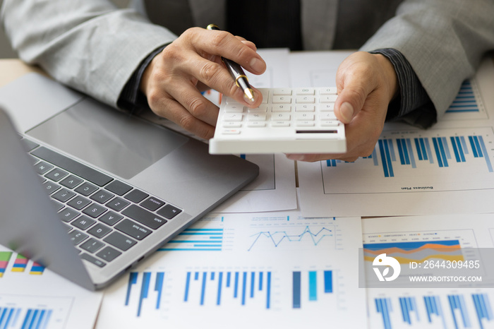 Calculation and analysis of financial statement accounting data on the desk. Financial concept tax system and budget allocation.