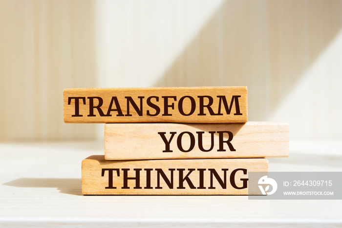 Wooden blocks with words ’Transform Your Thinking’.