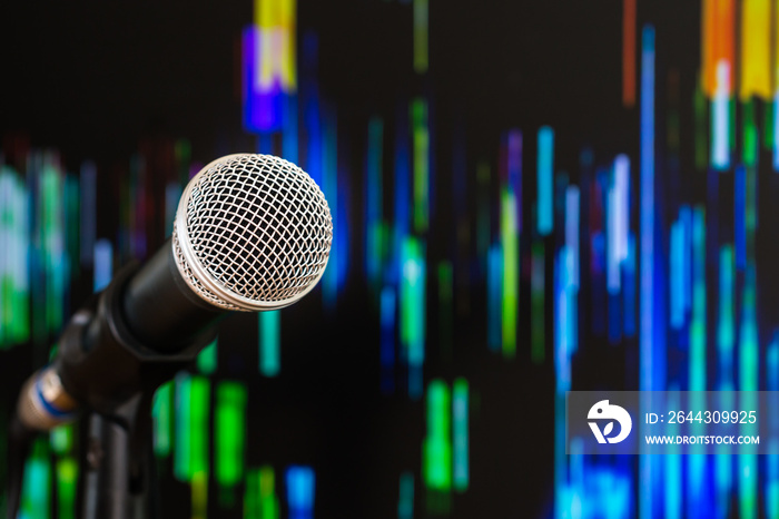 Microphone for speaker on speech in seminar room or speaking conference hall at public stage on podium convention event in light background. Comunication equipment meeting center concept