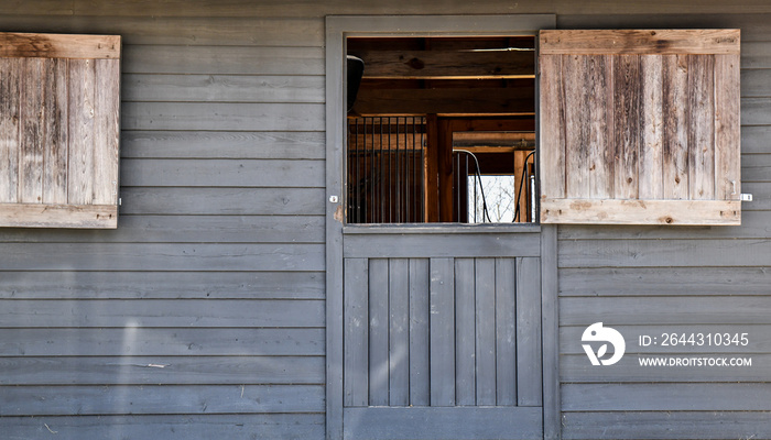 old wooden door to the horse stable