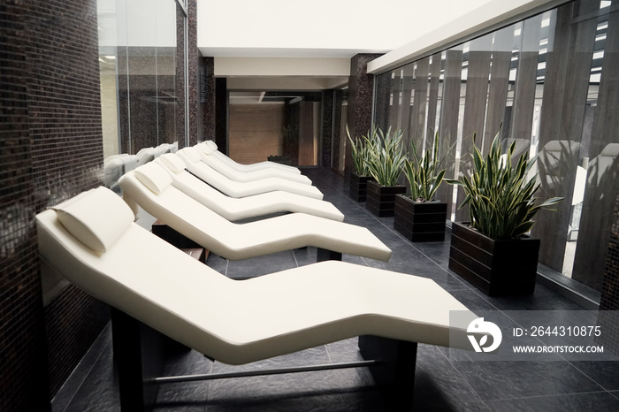 Loungers in cozy spa salon, closeup