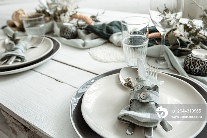 Stylish table setting for two with decor details.