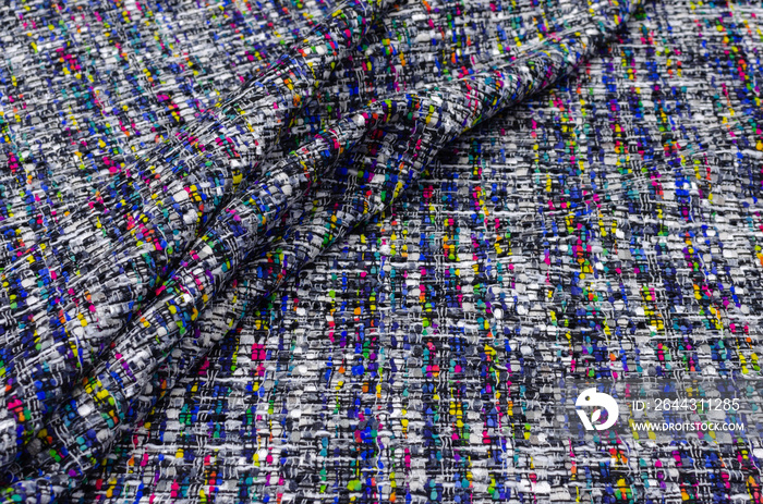 Tweed fabric with bright patches on black and white