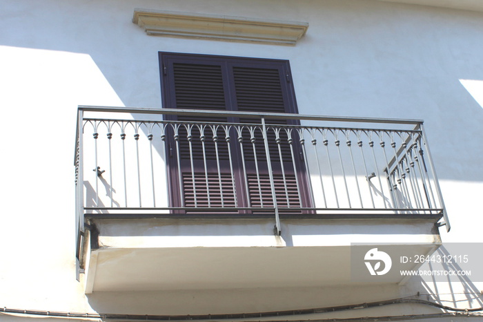 Traditional facade of European architecture with windows and balconies