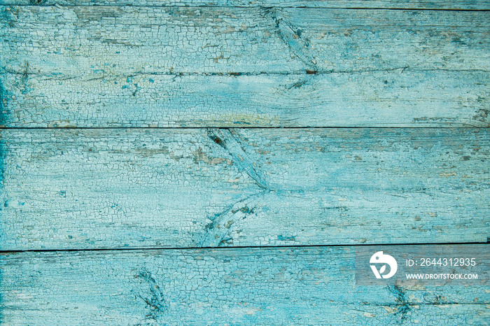 Old weathered wood plank painted in blue