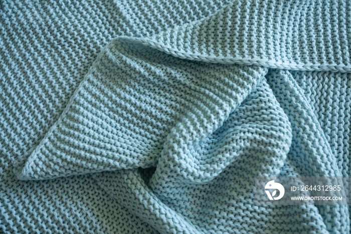 Handmade blue knitted wool blanket, knitting wool texture background