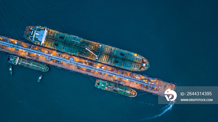 Aerial top view oil tanker ship loading in port view from above, Tanker ship logistic import export business and transportation.