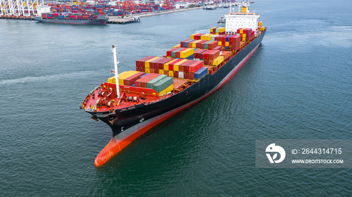 Aerial view container ship carrying container in import export business logistic and transportation of international by container ship in the open sea.