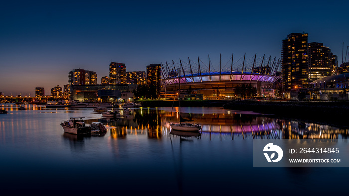 Vancouver Skyline at night with BC Place Stadium Lit Up at the North Shore of False Creek Inlet at night, British Columbia, Canada