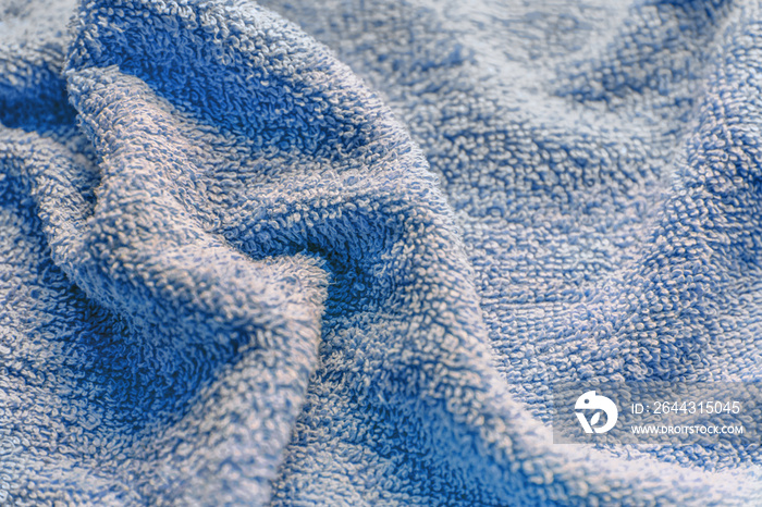 abstract background of bright blue terry towel close up