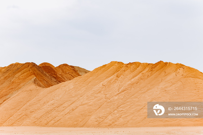 Construction sand mound quarry. A large sand mound in the mines.