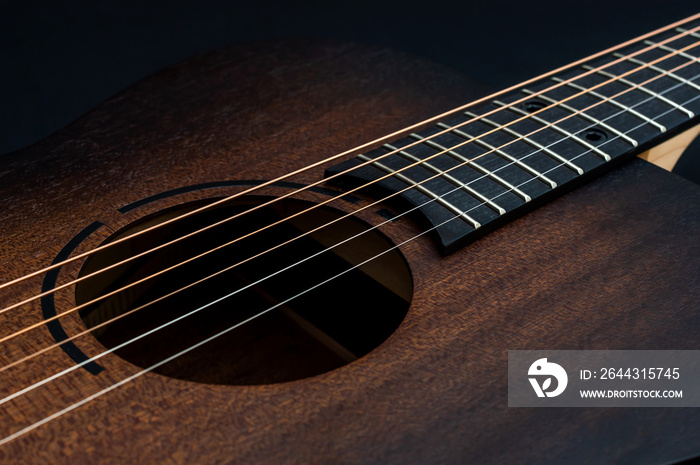 Wooden classical acoustic guitar. Close up.