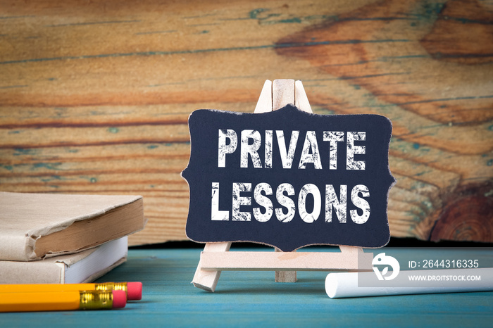 Private Lessons, education concept. small wooden board with chalk on the table.