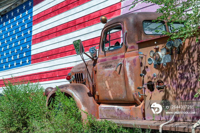 Old truck and american flag, symbol of US Route 66