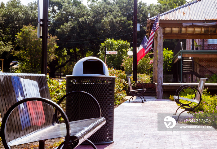 Park bench with Texas flag painted on the back in Montgomery, TX.