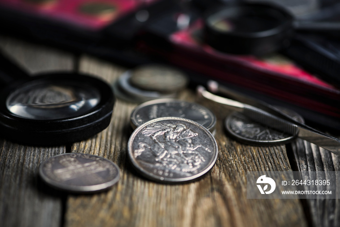 english old coin, numismatics on old wooden background